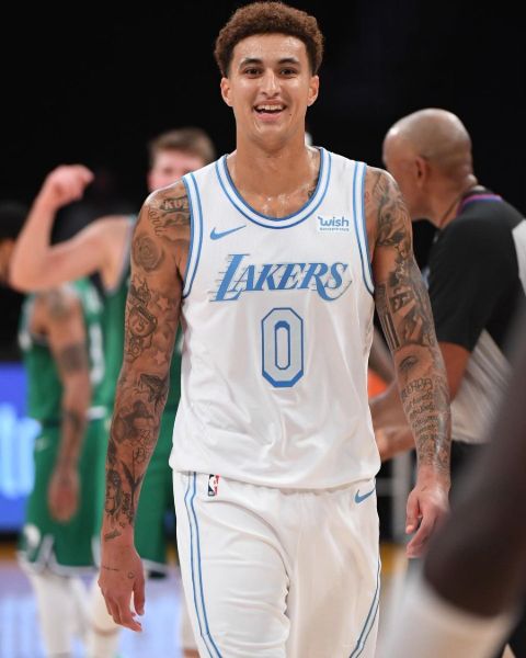 Kyle Kuzma poses a picture in LA Lakers' unique Christmas kit.